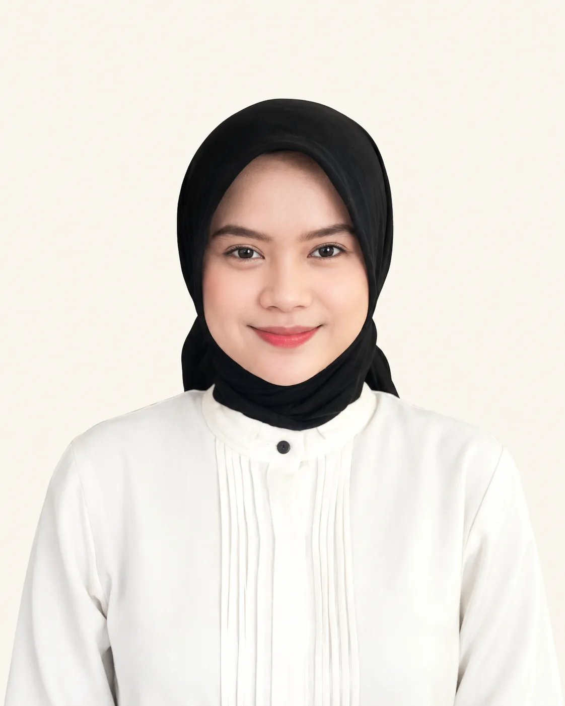 Husni Attin in a professional portrait wearing a black hijab and white blouse